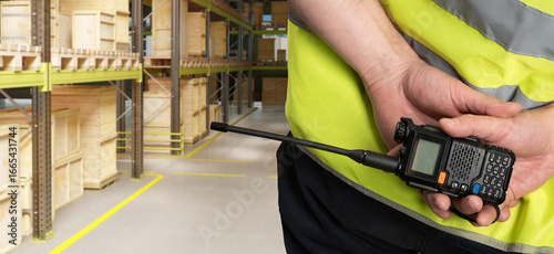 Walkie-talkie in hands of w...