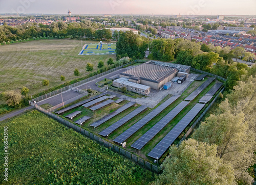 Aerial view of small local data center in the Netherlands with a lot of solar panels, online cloud storage locally