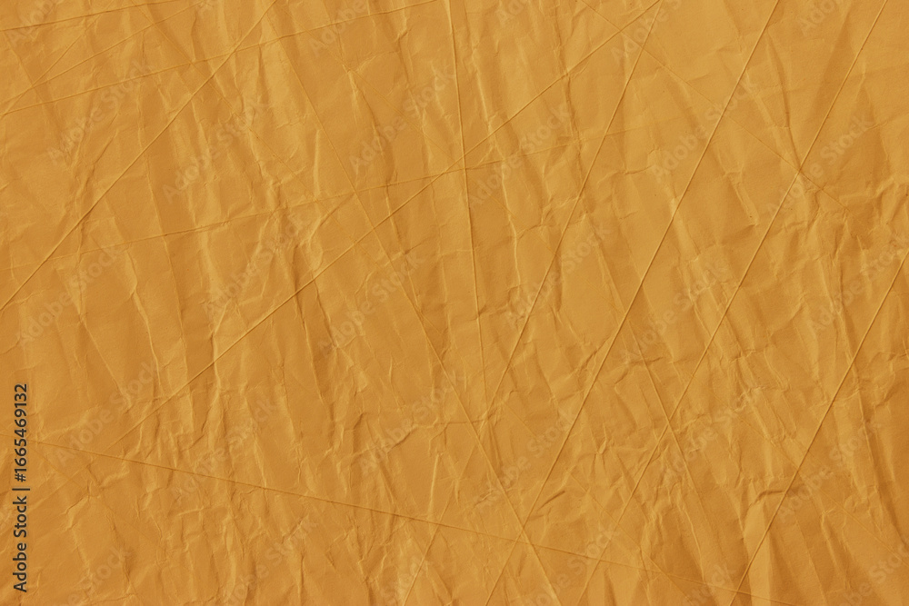 Fototapeta premium Abstract wrinkled golden crumpled paper texture background