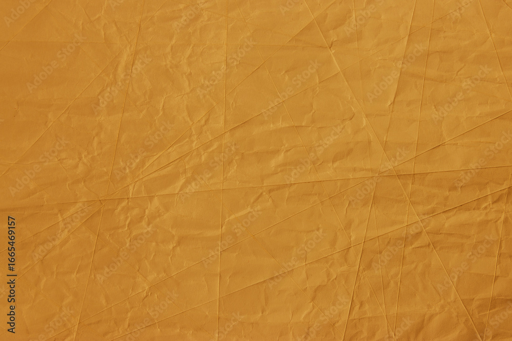 Obraz premium Abstract wrinkled golden crumpled paper texture background