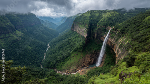Nohkalikai Falls India, tallest plunge waterfall, lush green cliffs, cinematic cloudy sky