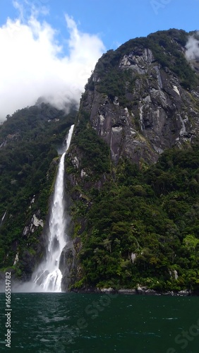 Majestic waterfall cascading down a rocky mountainside (1)