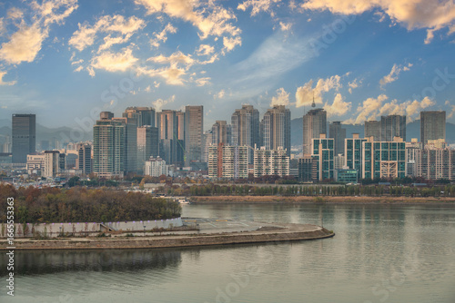 Seoul South Korea city skyline at Han River view from Yongbongjeong Park in a...