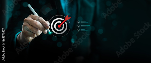 Photos Business goal setting concept with businessman using digital stylus to target ce