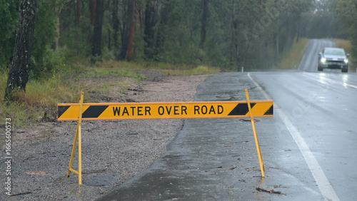 Water over road warning traffic sign
