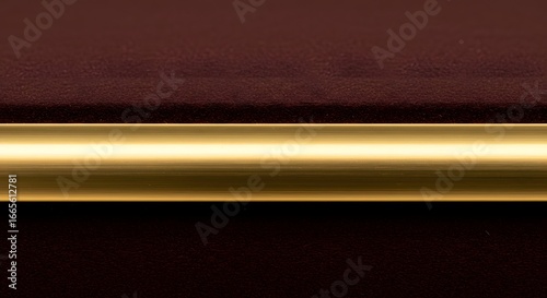 Close-up Macro Shot of a Gold Rod on Maroon Velvet Background: Elegant Minimalist Texture