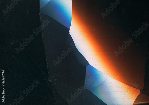 Aged film texture. Colorful crash screen. Orange white blue glow on dark black blur background. Techno damaged display free space.