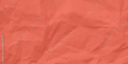 Pink crumpled paper texture background.
