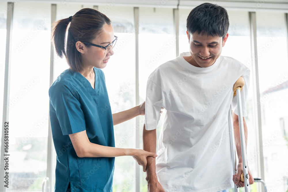 Obraz premium Physical therapy. Female Nurse aids young man in recovering from spine injury and providing orthopedic massage Orthopedic healthcare and chiropractor with person for physical therapy rehabilitation