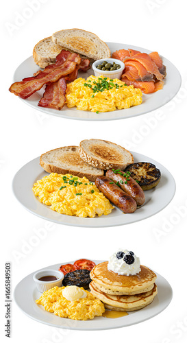 Three Breakfast Plates Featuring Eggs Bacon Toast Pancakes and Sausages Isolated