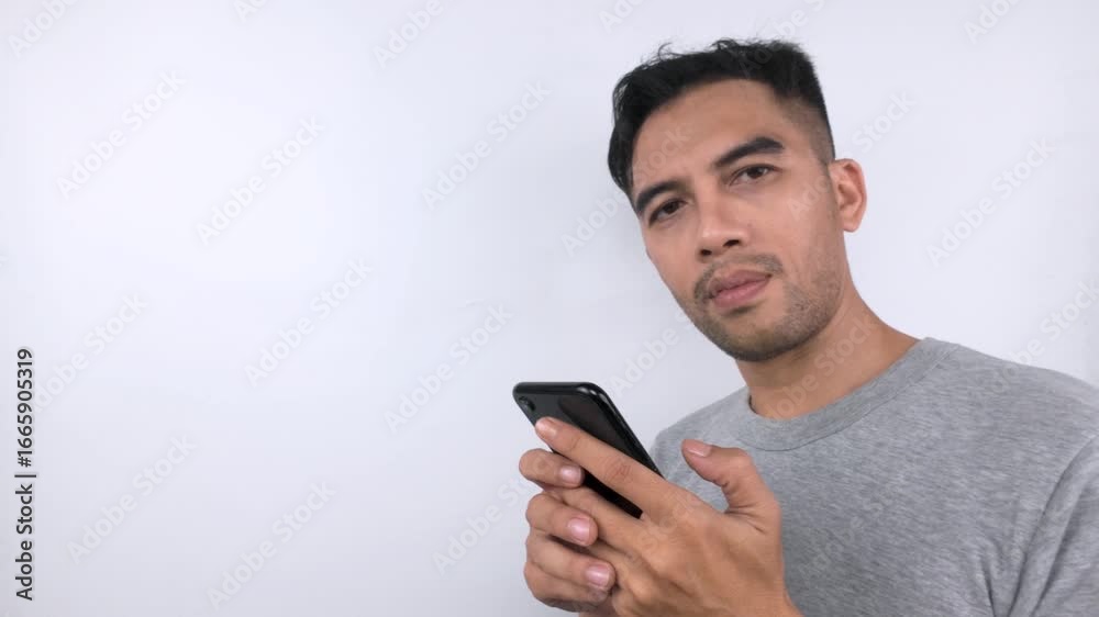 Man Focused on Smartphone, Close-up View, Digital Communication. Man Focused on Smartphone, Close-up View, Digital Communication.