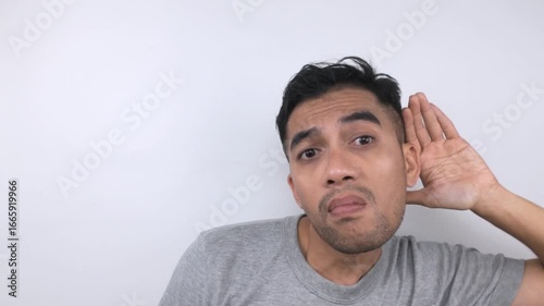 Mans Surprised Expression, Listening Closely, Studio Shot.