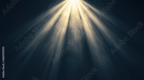 A spotlight shining down on a dark background.