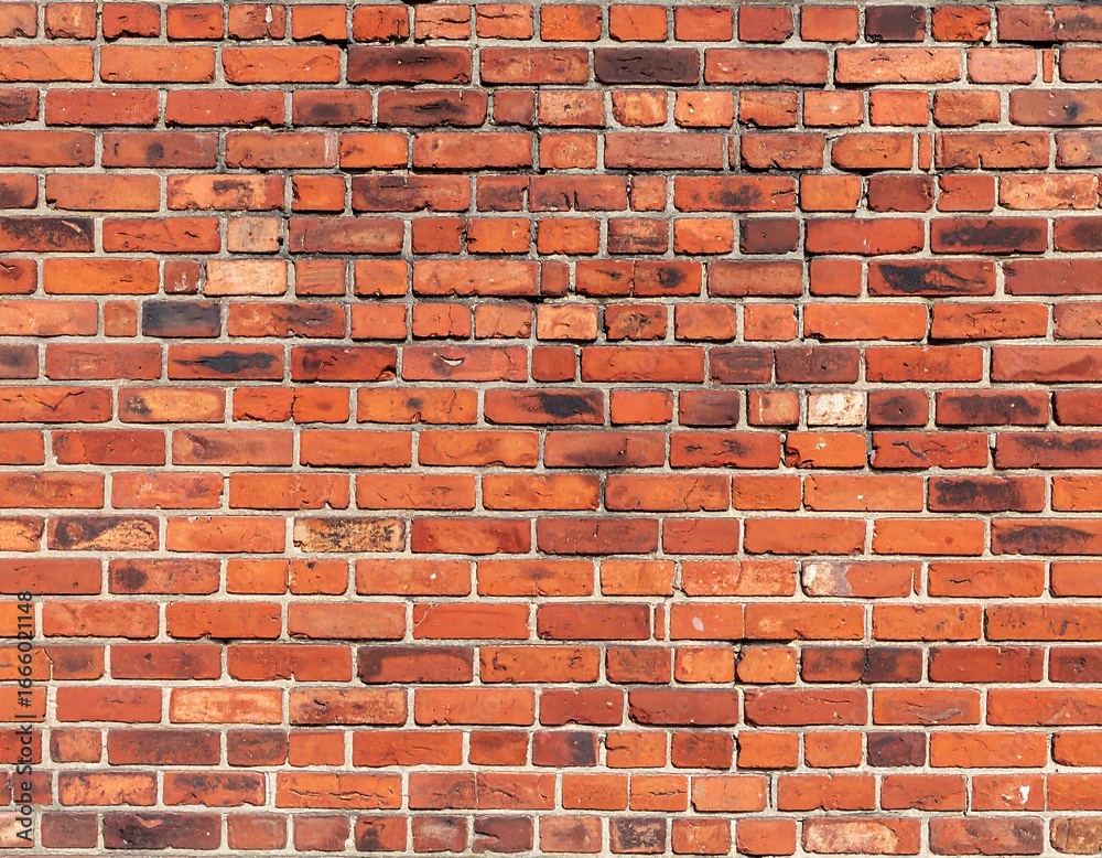 Naklejka premium Close-up view of a red brick wall