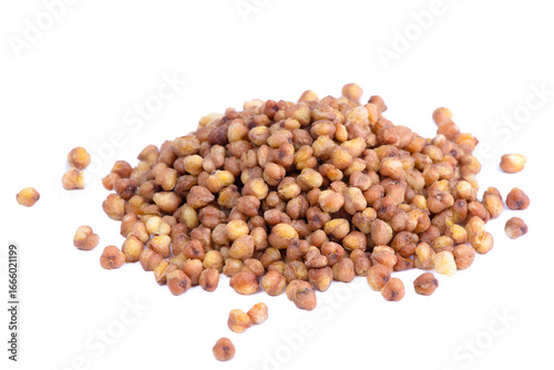 Light raw kuqiao isolated on white background. Buckwheat tea in roasted grains. Natural caffeine free herbal drink, gluten free superfood for wellness and cooking.	