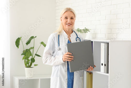 Mature female doctor with f...