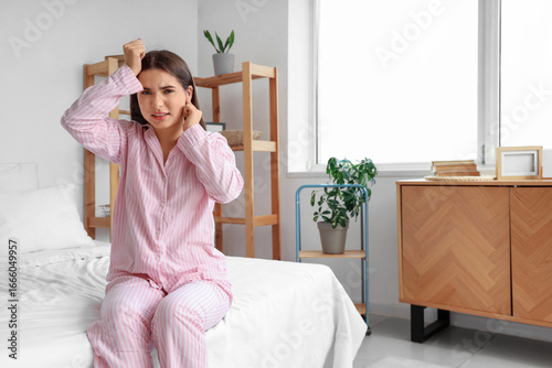 Young woman with otitis in ...