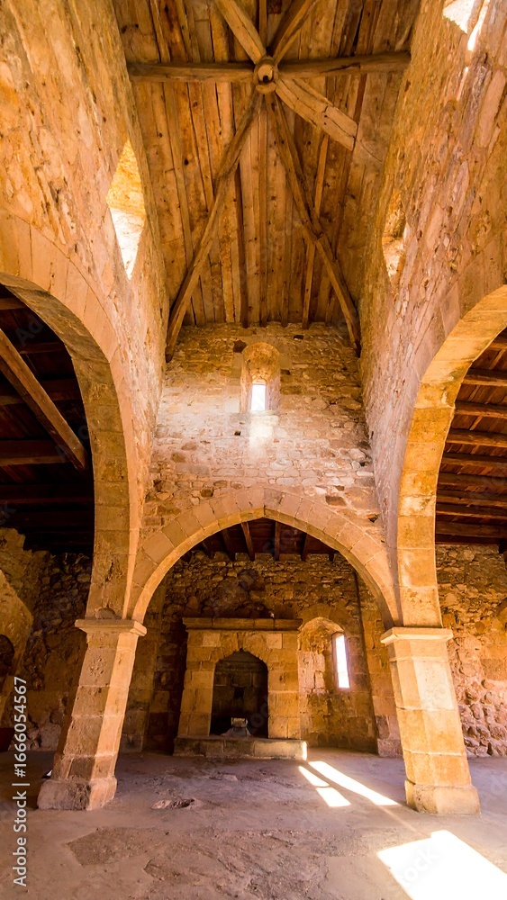 Fototapeta premium Ancient church interior, arches and wooden roof