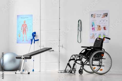 Physical therapy and rehabilitation clinic, wheelchair and crutches with exer...