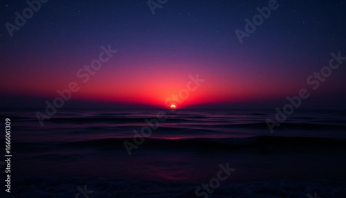 Breathtaking seascape with a red sun setting over the ocean