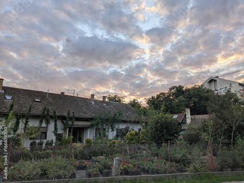 Wallpaper Mural Countryside home with tiled roof and blooming garden Torontodigital.ca
