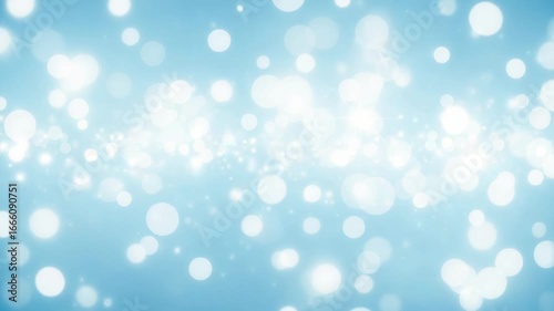 A soft and dreamy blue background filled with sparkling bokeh lights and glittering particles, creating a magical and festive atmosphere