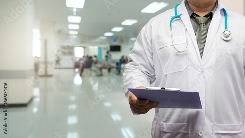 Fotografie Doctor in gown uniform with patient chart standing on patient screening point OPD background