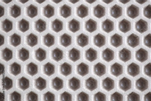 eva ethylene vinyl acetate car mat texture. waterproof carpet with beige honeycomb texture.