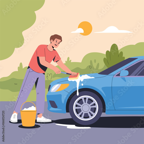 Man washing a blue car with a sponge and a bucket of soapy water in an outdoor setting on a sunny day