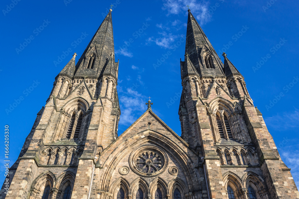 Fototapeta premium Front view with towers and rose window of Cathedral of St Mary in Edinburgh city, Scotland, UK