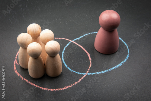 Canvas Print Social exclusion and individuality concept with colored figure and group separat