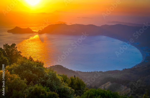 Fototapeta Naklejka Na Ścianę i Meble -  Popular beaches of Corfu. Amazing view at Agios Georgios Pagon beach in Corfu island at sunset, Greece