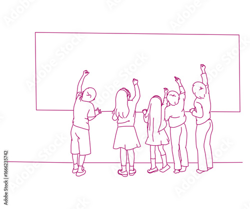 School children writing on blackboard