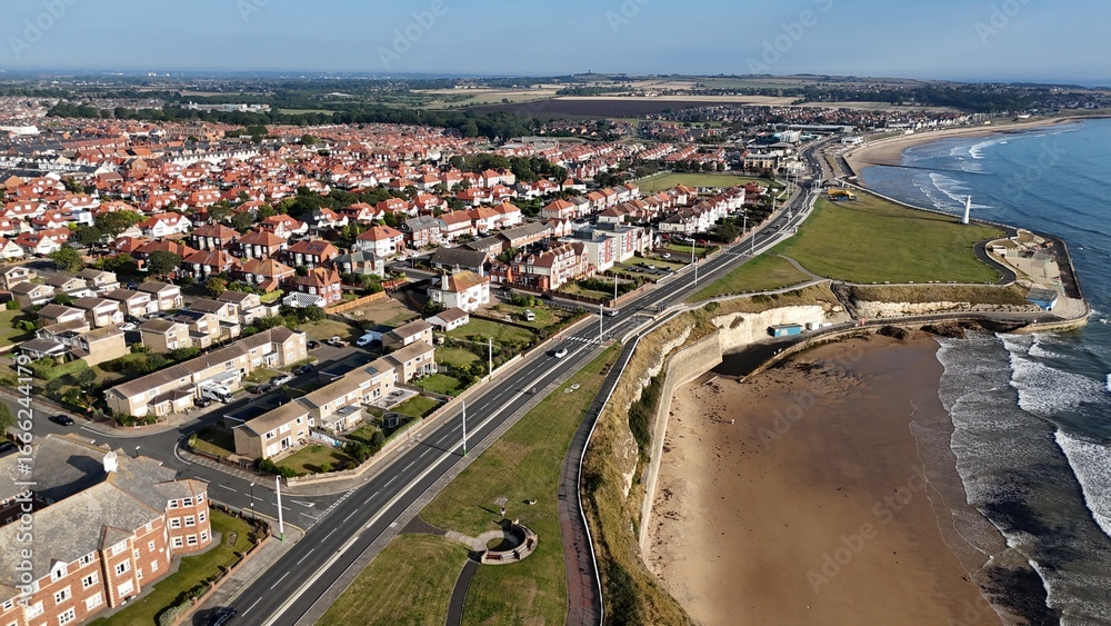 Fototapeta premium Drone Aerial View of Roker Beach, Seaburn Beach, and Roker Pier in Sunderland, Tyne and Wear, North East England, Coastal Landscape from Above