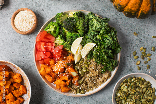 Healthy vegan Buddha bowl with quinoa, pumpkin and seasonal vegetables. Vegetable recipes.