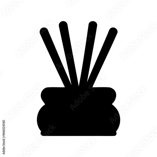 Silhouette of reed diffuser with elegant vase adds relaxation to the room