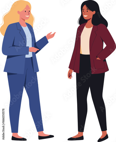 Two diverse professional businesswomen in suits having a friendly conversation and smiling.