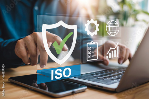 Business professional utilizing technology for iso certification process with security and quality management icons symbolizing compliance and standards excellence