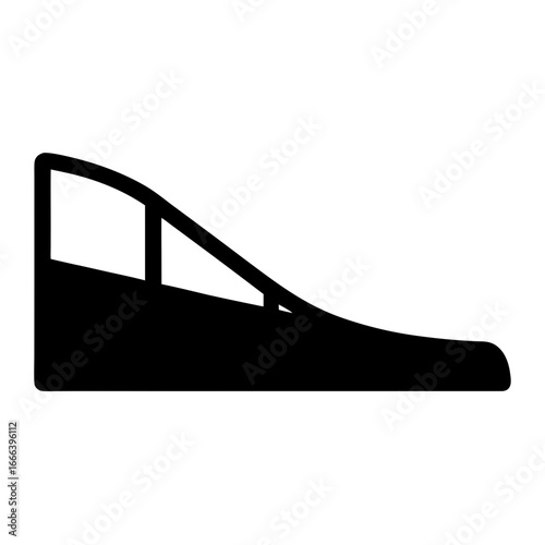 Silhouette of a quarter pipe ramp in a skatepark or extreme sports facility