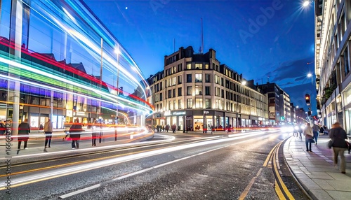 Vibrant City Street at Night with Colorful Light Trails and Blurred People