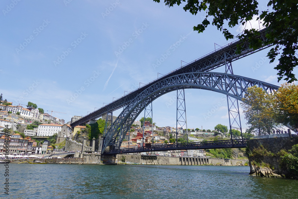 Fototapeta premium The view of Luis I bridge in Porto, Portugal., panorama opening from Vila Nova De Gaia