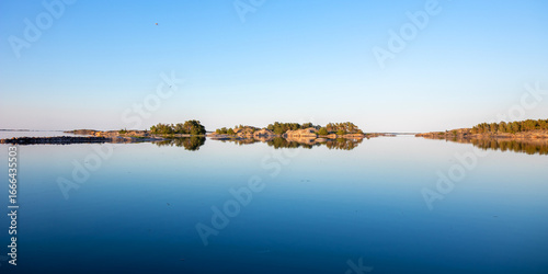 Εκτύπωση καμβά Northern coastal landscape of calm Baltic Sea with perfectly smooth water, clean