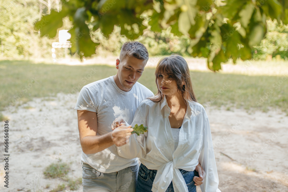 Obraz premium Young couple relax at nature at summer 