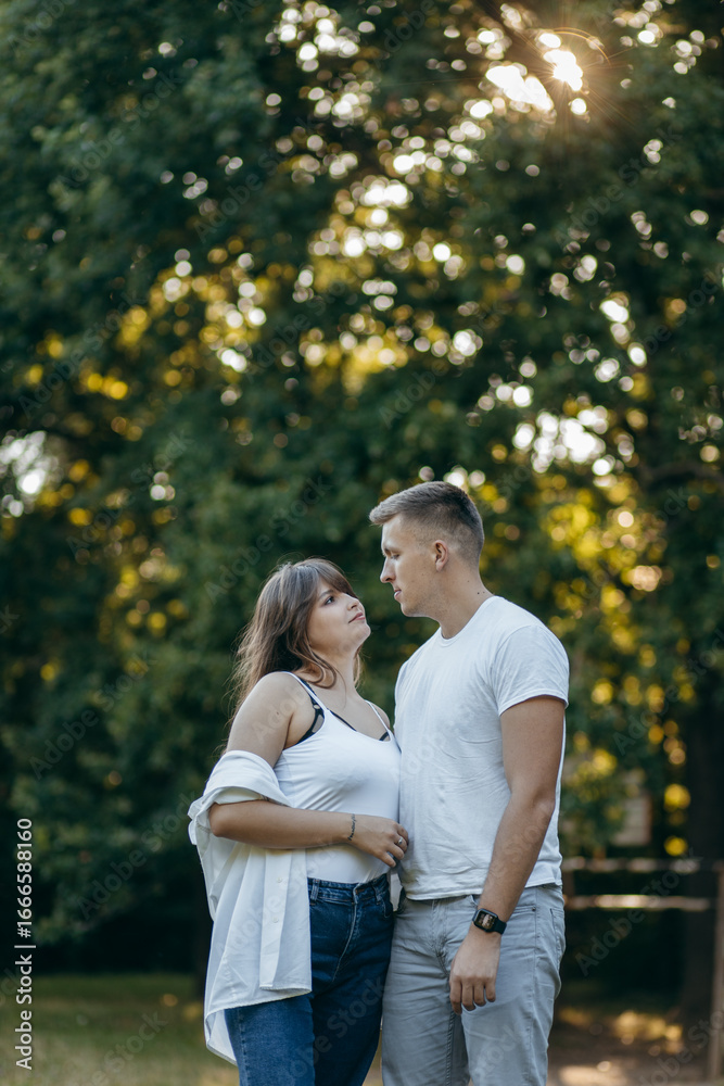 Fototapeta premium Young couple relax at nature at summer