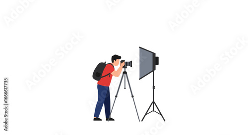 Photographer setting up lighting equipment for professional shoot with tripod