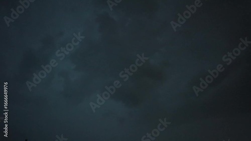 Lightning in the sky during rain in nature