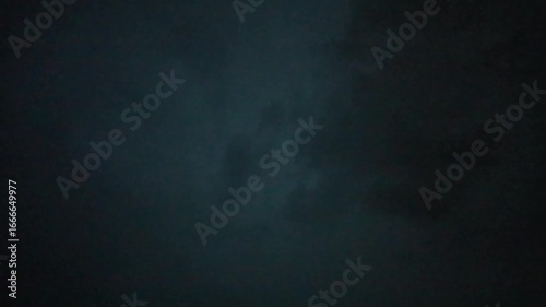 Lightning in the sky during rain in nature