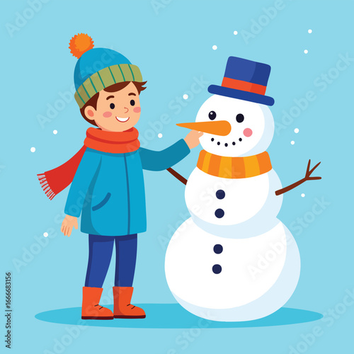 A smiling boy in winter clothes is putting a carrot nose on a snowman under falling snow.