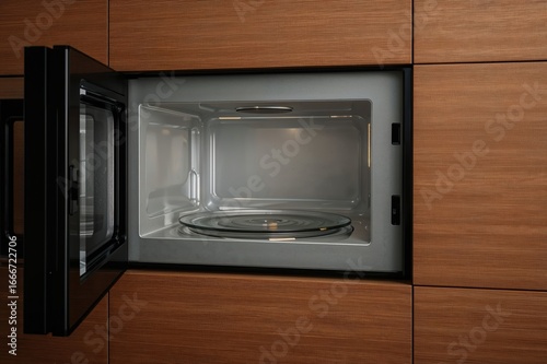 A sleek black microwave wit...