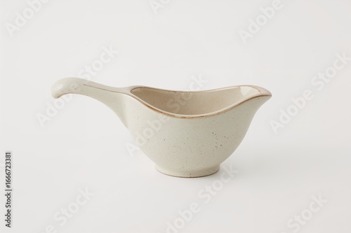 A tiny ceramic cooking pot ...